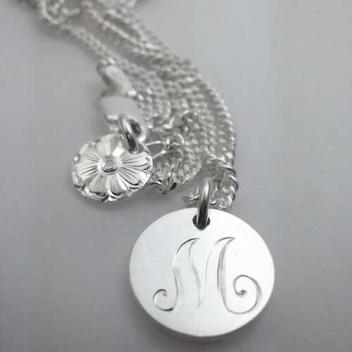  Hand-engraved pendants by Su Foster.